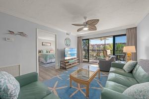 a living room with a couch and a table at Pointe Santo B25 in Sanibel