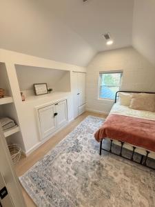 a bedroom with a bed and a rug at Lake House get away in Whitsett