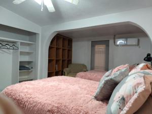 Ένα ή περισσότερα κρεβάτια σε δωμάτιο στο la casa de la tia Lucita