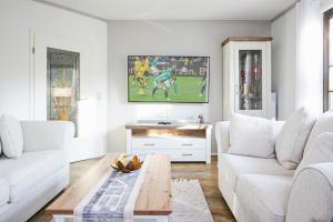 a living room with a couch and a table at Ferienhaus Poolaris in Pruchten