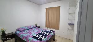 Ένα ή περισσότερα κρεβάτια σε δωμάτιο στο Villas murillo +12 φωτογραφίες