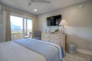 Ένα ή περισσότερα κρεβάτια σε δωμάτιο στο Mariner's Cove - A 202 +26 φωτογραφίες