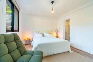 Ένα ή περισσότερα κρεβάτια σε δωμάτιο στο Nobregas Lodge