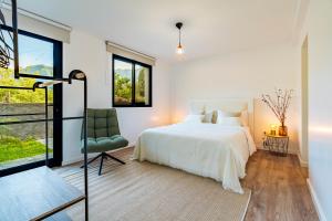 Ένα ή περισσότερα κρεβάτια σε δωμάτιο στο Nobregas Lodge