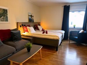 Ένα ή περισσότερα κρεβάτια σε δωμάτιο στο Fridhemsgatan City Stay