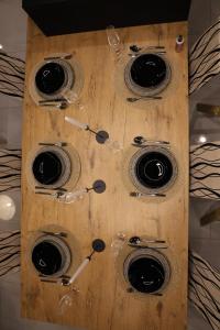 a wooden box with wine glasses on it at D'MMASS Holiday home Istria in Martinski