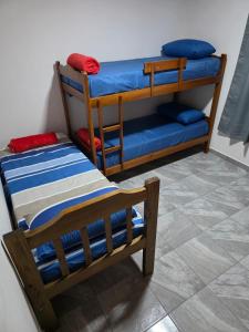 two bunk beds sitting next to each other in a room at Departamentos por dia in Eldorado