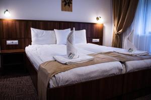 Ένα ή περισσότερα κρεβάτια σε δωμάτιο στο Hotel Claris +41 φωτογραφίες