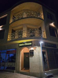 a building with a sign that says just a dream at Just a Dream - guest apartments in Troyan
