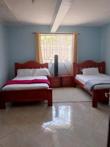 Ένα ή περισσότερα κρεβάτια σε δωμάτιο στο Ole supat Diani luxury villas