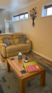 a living room with a couch and a coffee table at The cottage in Bury Saint Edmunds +13 photos
