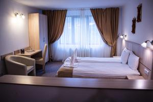 Ένα ή περισσότερα κρεβάτια σε δωμάτιο στο Hotel Claris +47 φωτογραφίες