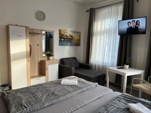 Ένα ή περισσότερα κρεβάτια σε δωμάτιο στο Pension Kaditz