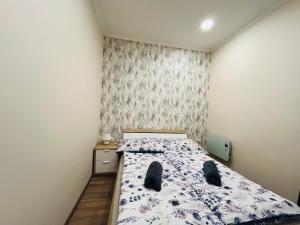 Ένα ή περισσότερα κρεβάτια σε δωμάτιο στο Vadszőlő Apartman