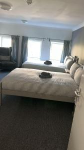 a large bed in a room with a couch at Whole property in Kirkcaldy Fife in Fife