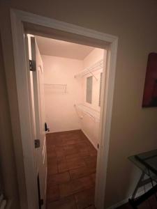 a hallway with a door leading into a room at West Valley King Room 94th in Phoenix