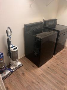 a black computer printer sitting on top of a floor at West Valley King Room 94th in Phoenix