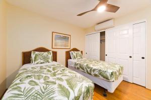 Ένα ή περισσότερα κρεβάτια σε δωμάτιο στο Oceanfront Condo with Stunning Views