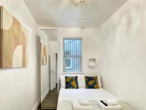 Ένα ή περισσότερα κρεβάτια σε δωμάτιο στο Granada Apartments Derby Road