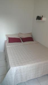 Ένα ή περισσότερα κρεβάτια σε δωμάτιο στο Espaço Acalanto