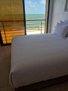 Ένα ή περισσότερα κρεβάτια σε δωμάτιο στο Horizon bleu