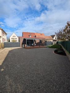 a house with a red roof and a driveway at Gîte l'Hortensia Rose in Guémar +29 photos