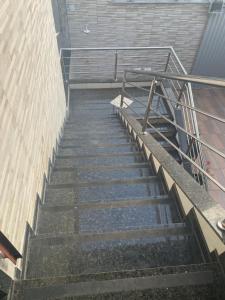 a set of stairs next to a building at Casa temporada em Perocão in Guarapari