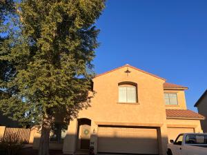a house with a white truck parked in front of it at West Valley King Room 94th in Phoenix