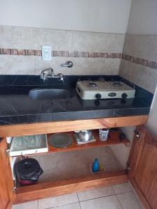 Η κουζίνα ή μικρή κουζίνα στο Departamentos Rimasha