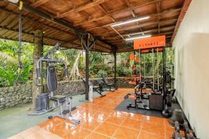 an image of a gym with treadmills and weights at Rio Danta in Fortuna