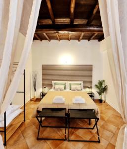 a bedroom with a large bed in a room at La Magia del Borgo in Genzano di Roma