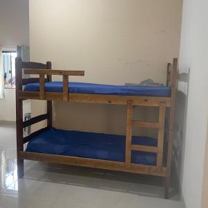 Μία ή περισσότερες κουκέτες σε δωμάτιο στο Chacara a 10 minutos dá Basílica de Aparecida-sp