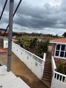 a view of a garden from the balcony of a building at Casa Cañón ecolodge in Los Santos