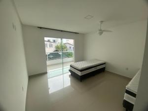 Voodi või voodid majutusasutuse Requinte e Conforto em Guarapari toas +60 fotot