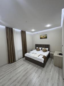 a bedroom with a bed and a large window at Samanid hotel in Salor Bekati +39 photos