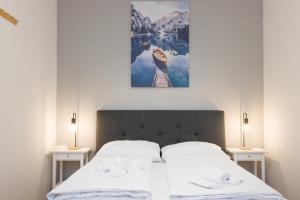 En eller flere senge i et værelse på Cosy Penzing