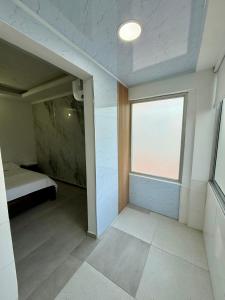 Ένα ή περισσότερα κρεβάτια σε δωμάτιο στο Apartaestudio Luiggis Cucuta +17 φωτογραφίες