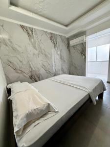 Ένα ή περισσότερα κρεβάτια σε δωμάτιο στο Apartaestudio Luiggis Cucuta