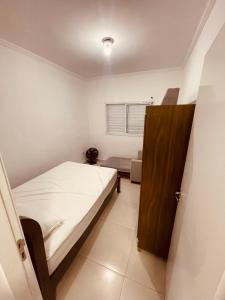 Ένα ή περισσότερα κρεβάτια σε δωμάτιο στο Sobrado invertido 2 Quartos