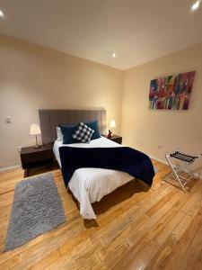a bedroom with a large bed with blue pillows at Loft Santorino 2 Valquirico in Nativitas