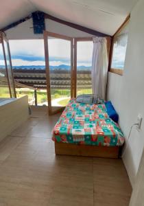 Ένα ή περισσότερα κρεβάτια σε δωμάτιο στο finca buenavista cabaña horizonte +15 φωτογραφίες