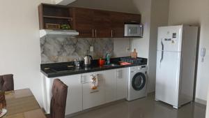 Kuchyň nebo kuchyňský kout v ubytování Apartamento1978