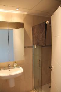 a bathroom with a sink and a shower at Las Olas Denia in Denia