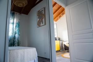 a door leading into a living room with a table at Casa Naya in Pointe-Noire