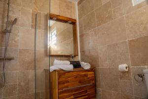 a bathroom with a shower and a glass shower stall at Casa Naya in Pointe-Noire