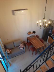 a living room with a couch and a table at Chalé Colibri in Vale do Capao +42 photos