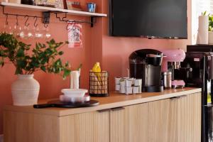 a kitchen with a counter with a coffee maker at The Muse Hotel in Palm Springs