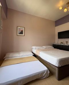 Postel nebo postele na pokoji v ubytování 14F Deluxe Unit at Sunvida Tower across SM CITY