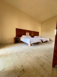 Giường trong phòng chung tại Suites Piamonte