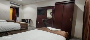 Postel nebo postele na pokoji v ubytování فندق سحر السيمت